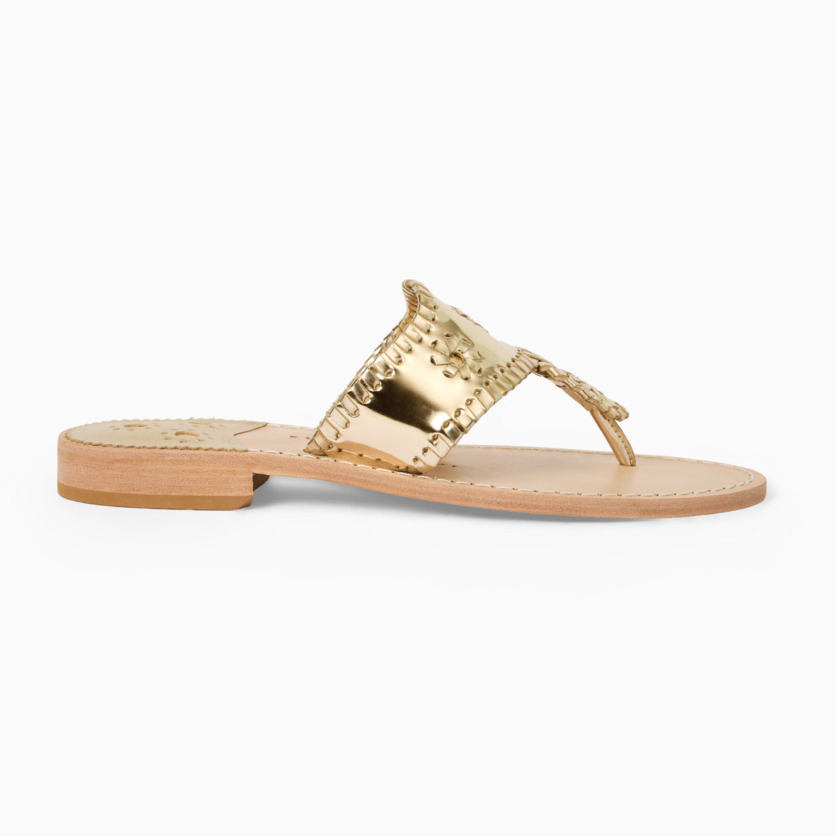 A single flat thong sandal in metallic gold with a low stacked heel, shown in profile against a clean white background.