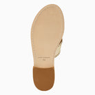 Top-down view of a sandal's tan leather footbed and sole, featuring a brown rubber heel cap and set against a plain white background.